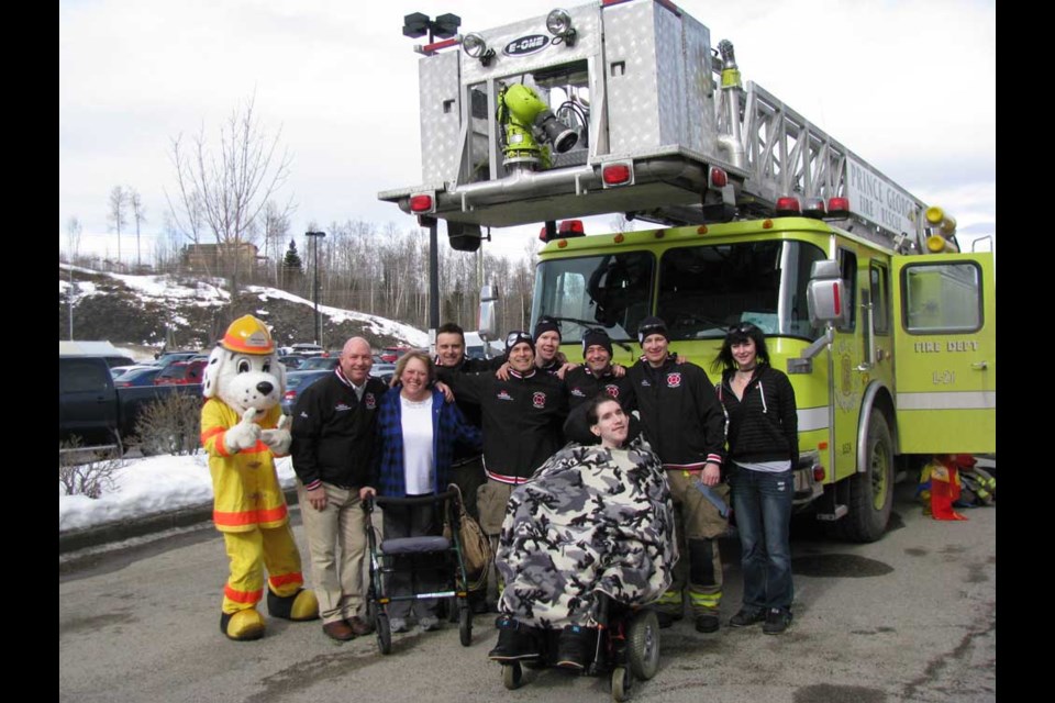 Citizen staff photo
Just before fire fighters take to the Canadian Tire Rooftop Campout for 48 hours a few gather together. From left is Sparky, fire fighters' mascot, Ian Provan, fire fighter and ground crew, Susan Andrist, former Northern chapter president of Muscular Dystrophy Canada, fire fighters Shane Lapierre, Wayne Weis, Jeremy Kostyshyn, Clayton Sheen, Mike Stachoski and Dana Slater, care giver of Darren Wilhelm, in front.