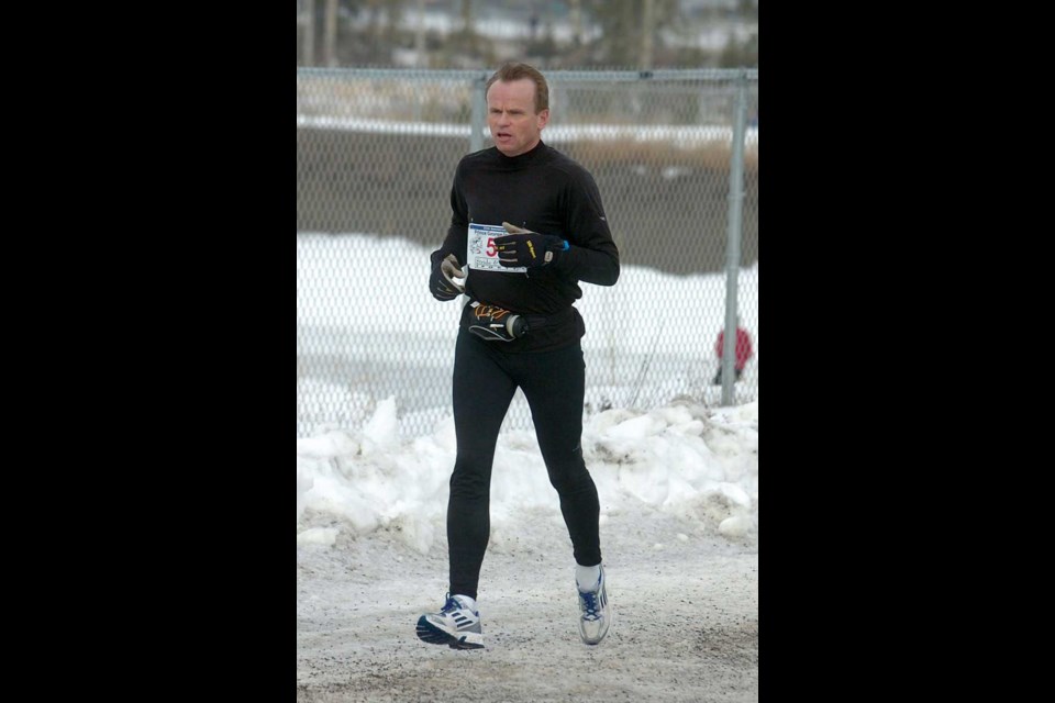 Citizen photo by Chuck Nisbett
Ted Clarke, Citizen reporter, finishes the 10km run as he approaches the ice oval.