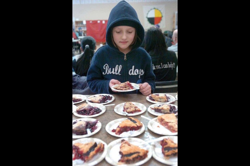 Shasha Kendall, 10, decides on her piece of pie, made by Sara for the crowd at the Coldsnap workshop Saturday.
Jan 23, 2012.
Citizen photo by David Mah
