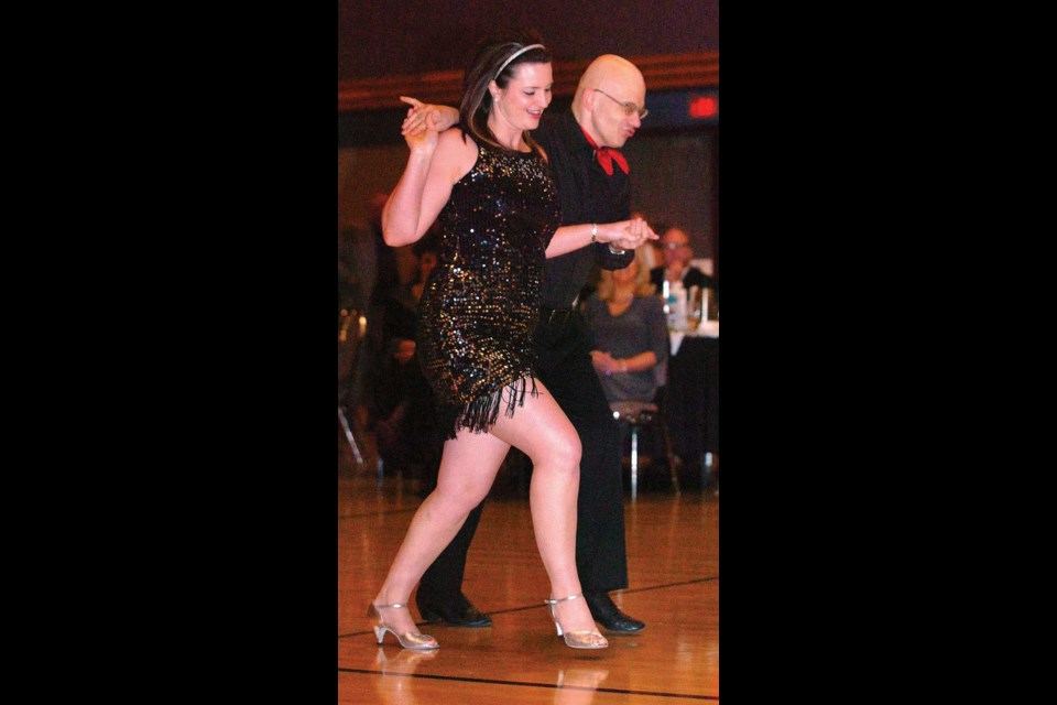 Jennifer Brandle-McCall and Paul Eberlain strut across the floor in their cha-cha presentation during Boogie with the Stars held at the Civic Centre new year's eve.
Jan. 3. 2012
Citizen photo by David Mah