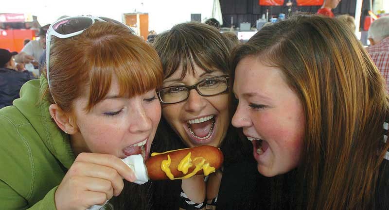 Daphne Jensen, left, Dorina Berno, and Nicole Jensen, enjoyed the PGX, and a delicious corn dog.
Aug. 11. 2012
Citizen photo by David Mah