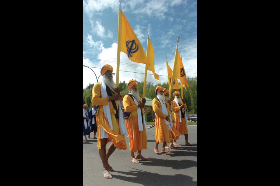 Sikh elders make their way along Ospika to the CN Centre.