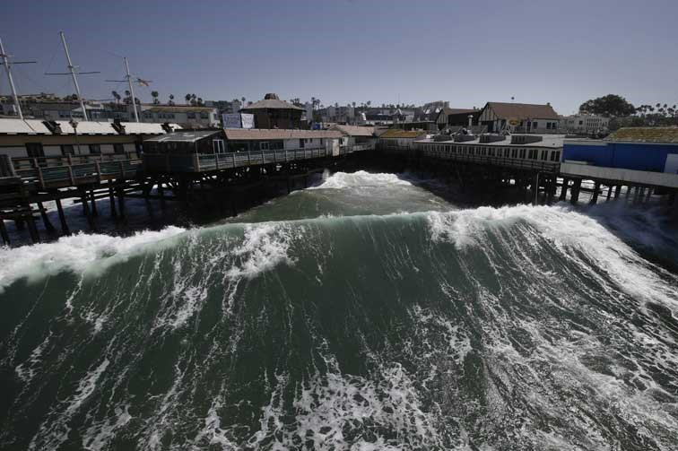 Waves hit the Redondo Beach Pier in Redondo Beach, Calif., Monday, April 8, 2013. Strong winds have begun raking parts of Southern California. The National Weather Service says the gusty northwest-to-north winds will become widespread across the region Monday and continue into the night.(AP Photo/Jae C. Hong)
