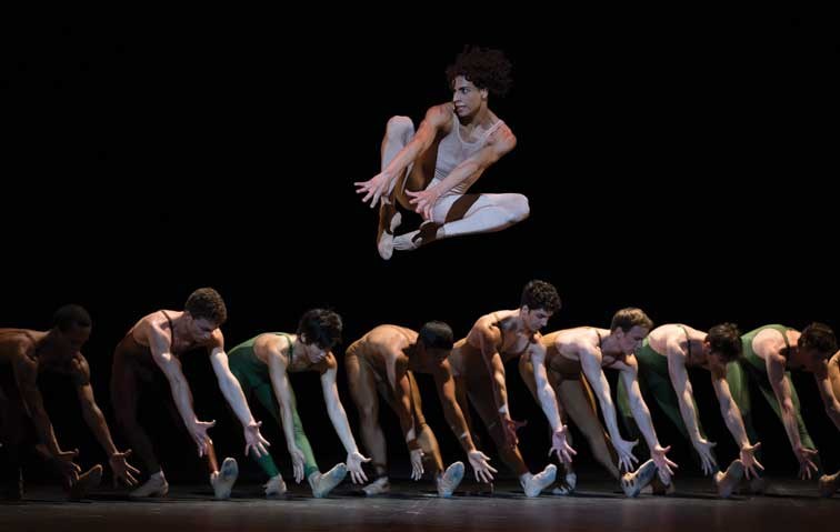 Dancer Oscar Chacon, top, performs a scene of the new production of Igor Stravinsky's The Rite of Spring in the Bolshoi Theater in Moscow, Russia, Wednesday, April 3, 2013.The renowned Russian theater celebrates the ballet's centennial anniversary by staging the new production and reviving three classic ones by Vaslav Nizinsky, Maurice Bejart and Pina Bausch. (AP Photo/Alexander Zemlianichenko)
