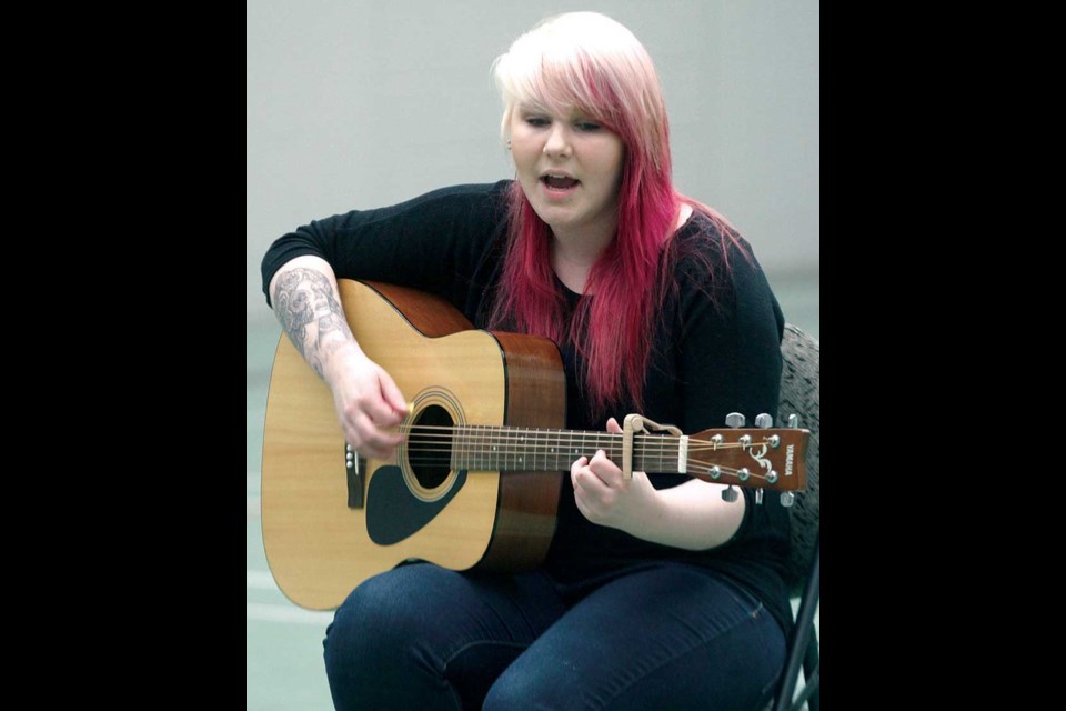Kyra Kristmanson, 20, accompanied herself on guitar, as she sang Such Great Heights for the judges in the gym at AimHi during auditions for PG's Got Talent Saturday
