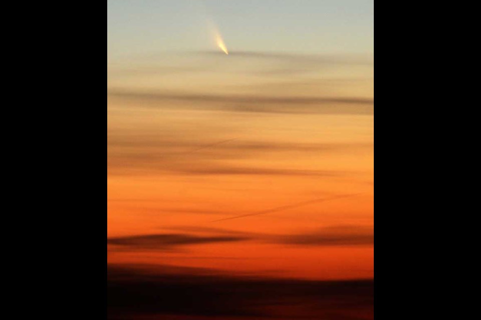 The PAN-STARRS comet is visible Wednesday evening March 13, 2013, from the Flint Hills of south western Lyon County Kansas. Although billions of year old, Pan-STARRS is making its first-ever cruise through the inner solar system. (AP Photo/ The Emporia Gazette, Matthew Fowler)