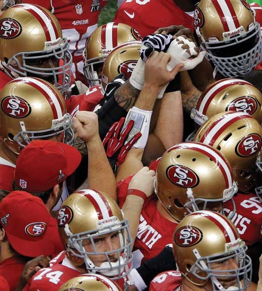 San Francisco 49ers players huddle before the NFL Super Bowl XLVII football game against the Baltimore Ravens, Sunday, Feb. 3, 2013, in New Orleans. (AP Photo/Charlie Riedel)