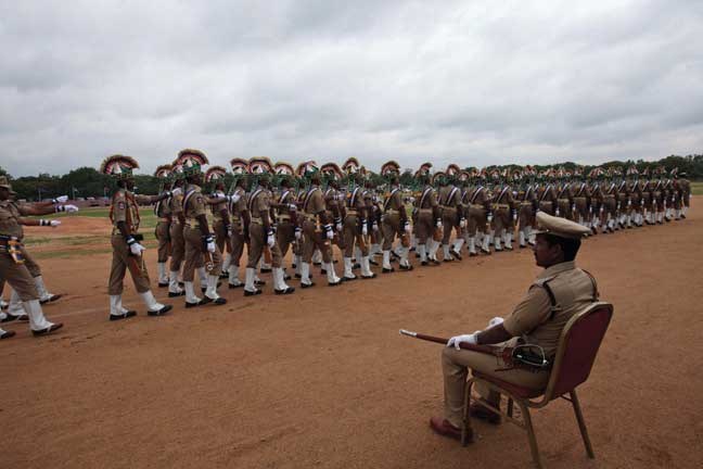A police officer inspects a parade rehearsal of the upcoming Independence Day celebrations in Hyderabad, India, Tuesday, Aug. 13, 2013. India celebrates its Independence Day on Aug. 15. (AP Photo/Mahesh Kumar A.)
