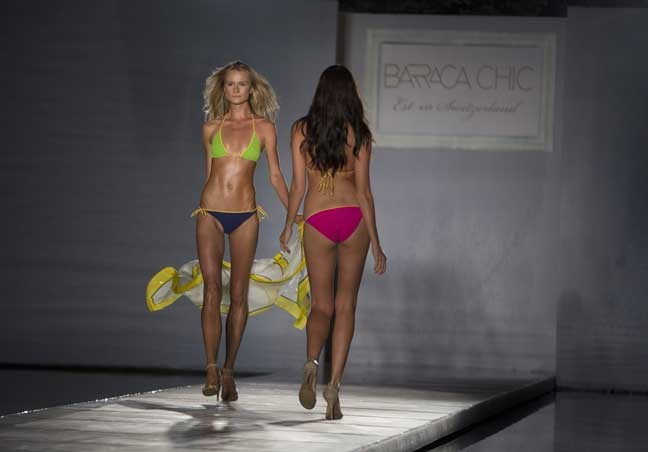 Models walk the runway wearing Barraca Chic swimwear, Thursday, July 18, 2013 in at the MBFW Swim fashion show in Miami Beach. The swim ware, for the holiday colllection, is embellished with Swarovski crystals, sand and stones. The swimwear line is from Zurich. (AP Photo/J Pat Carter)