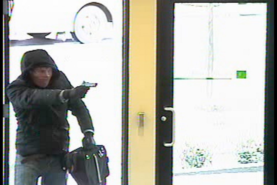 Stills from surveillance footage of a man who robbed a Saanich TD Bank Thursday. If you've seen him, notify Saanich police.
