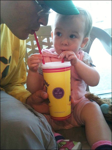 Ryan Johnson and his daughter Ruby savour the taste of a refreshing smoothie.