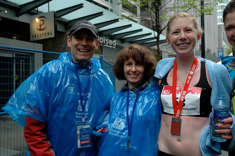 Gibsons Kim Doerksen, right, is all smiles at the finish line with Larry and Teresa Nightingale of Halfmoon Bay, who served as race officials at last Sunday’s BMO Vancouver Marathon. Doerksen won the women’s title in a time of 2:37 flat