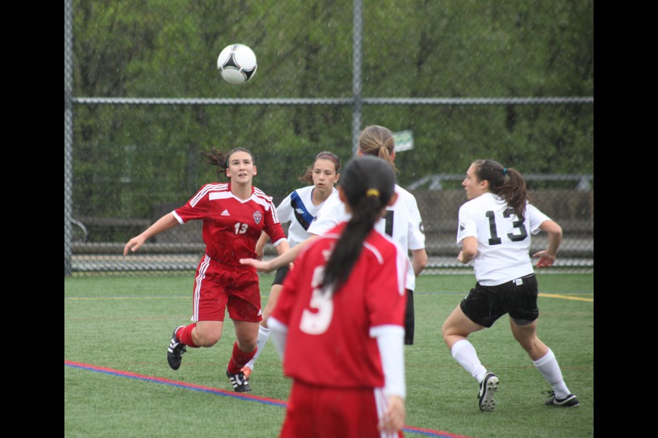 05-04-2014
Mountain United FC (red) against Vancouver Island. u14 girls premier soccer.
photo Jason Lang