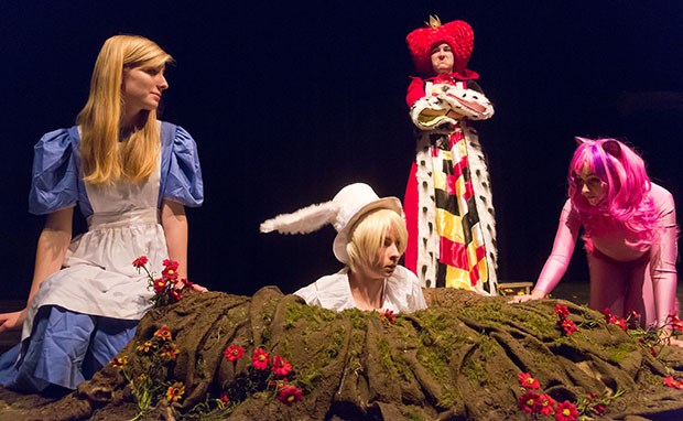 A frightened Alice (Hannah Everett), a disapproving Queen of Hearts (Elizabeth Dane) and a curious Cheshire Cat (Rachel Garret) look on as the Mad Hatter (Tim MacDonald) pops up from a rabbit hole in the stage floor of the Equinox Theatre. South Delta Secondary’s production of Alice in Wonderland opens next Tuesday.