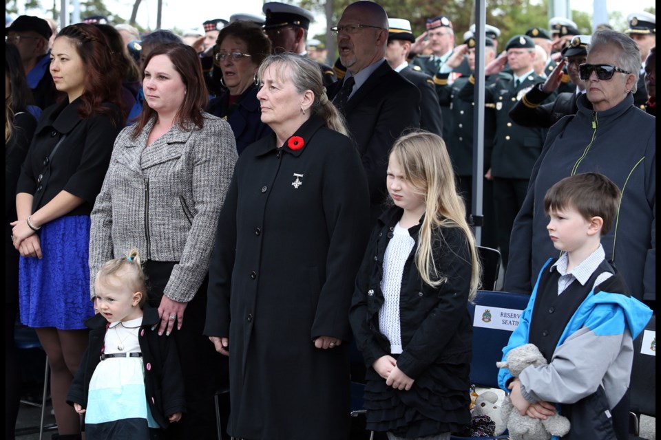 The family of Myles Mansell attends a National Day of Honour ceremony Friday at CFB Esquimalt. Mansell died while on duty in Afghanistan on April 22, 2006, when a mine detonated under his vehicle.May 9, 2014