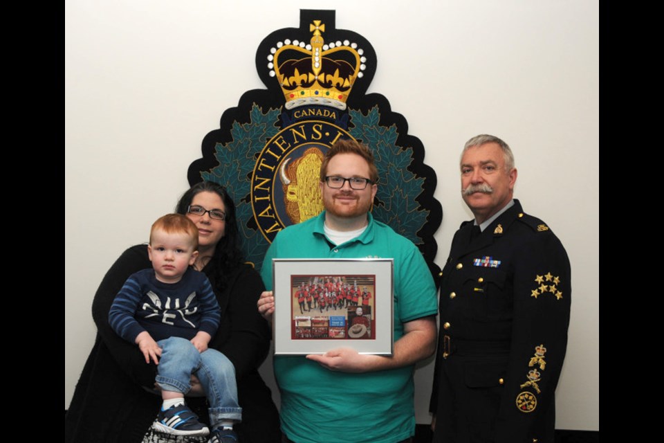 From left: Keian's mother Chantal Blundell holding Keian's baby brother, Joren Blundell, Keian's father Ryan Blundell and Staff Sgt. Maj. John Buis.