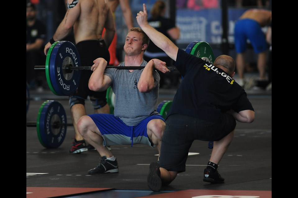 Joe Scali of Vancouver's Studeo 55 completes an overhead squat at the Canada West CrossFit Games at the Richmond Olympic Oval on May 10. He finished fourth overall.