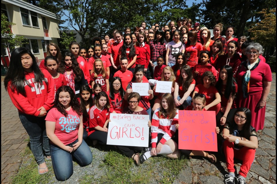 St. Margaret's School students ranging from grade 7-12 dress in red and rally to show support for Nigerian girls kidnapped from their own school.