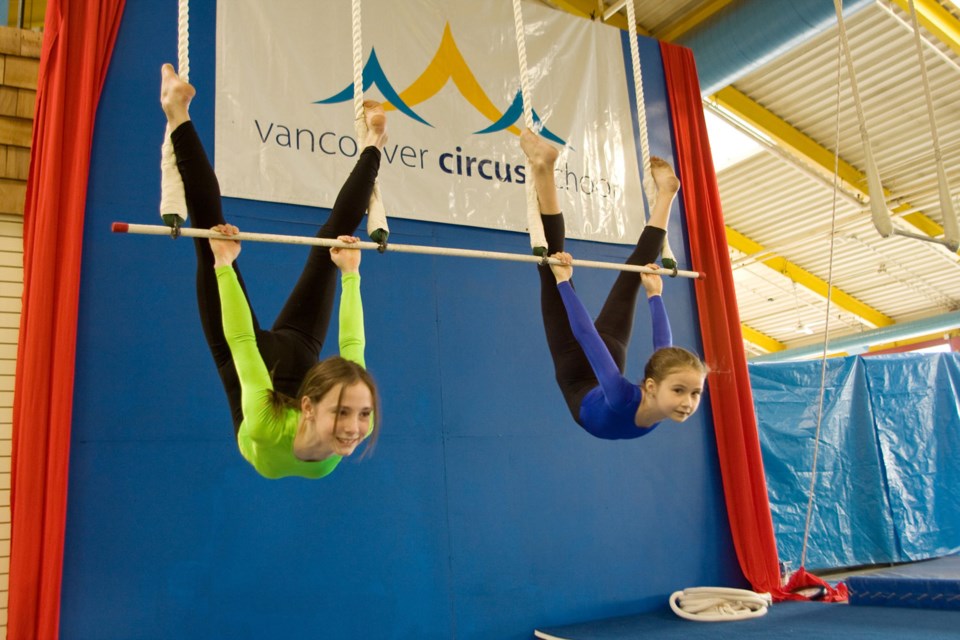 Students learn the fine art of trapeze at a previous Vancouver Circus School camp. The school is once again offering summer camps at its New West location.