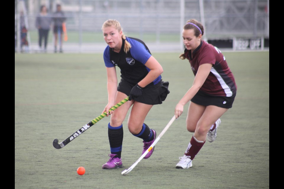 05-18-2014
Burnaby Lake (blk, blue) vs. West Vancouver, coed game at Vancouver International field hockey tournament.
photo Jason Lang