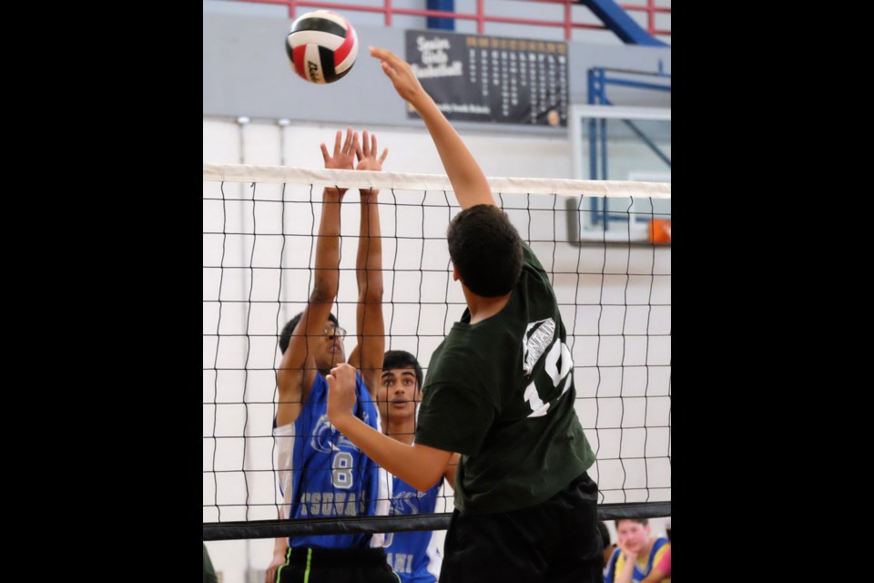 BNW grade 8 boys volly ball between NW Queensborough ( blue) and Bby Mountain at bby South. NW - Debbie Jones 604-517-6040