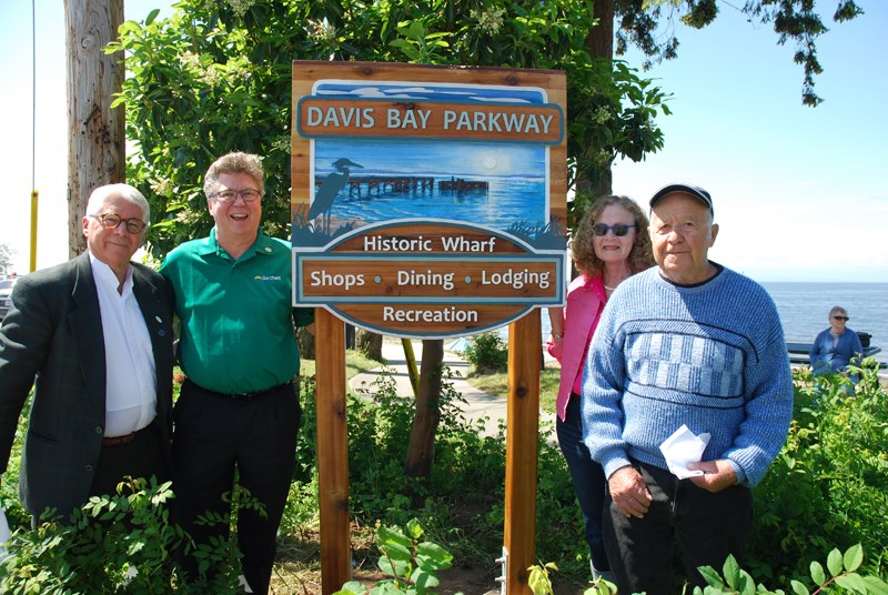 From left: Sechelt Coun. Doug Hockley, Sechelt Mayor John Henderson, Davis Bay Parkway Society vice-chair Sue Adams and Davis Bay Parkway Society chair Lockie Brock unveil a new parkway sign in Brookman Park on Wednesday, May 28. See more photos and video at www.coastreporter.net