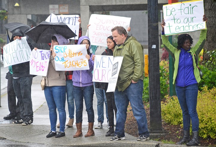 Students demonstrate at Burnaby city hall to support teachers who walked off the job Thursday as part of province-wide rotating teacher strikes.