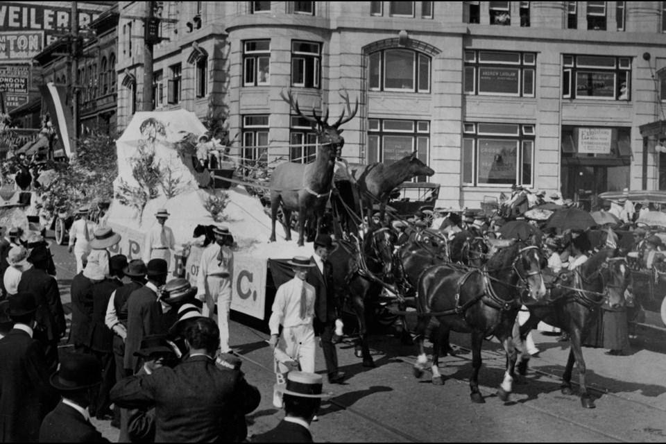 The Aug. 8, 1913, Carnival parade, which started at Vancouver and Yates streets, passes the just-completed Belmont building on Government at Humboldt streets.
