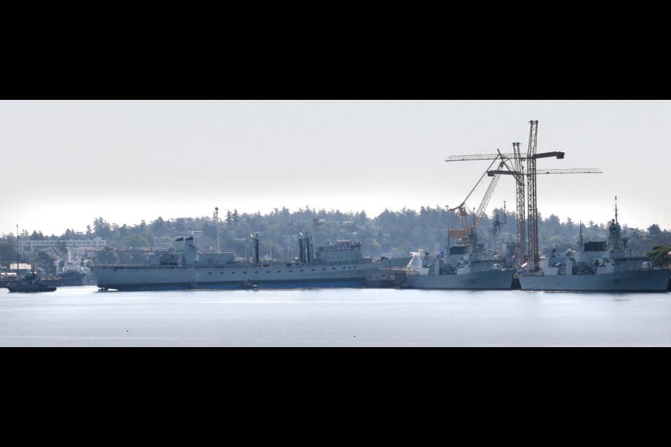 Fire-damaged HMCS Protecteur arrives in Esquimalt Harbour on Saturday after being towed 4,300 kilometres from Hawaii.