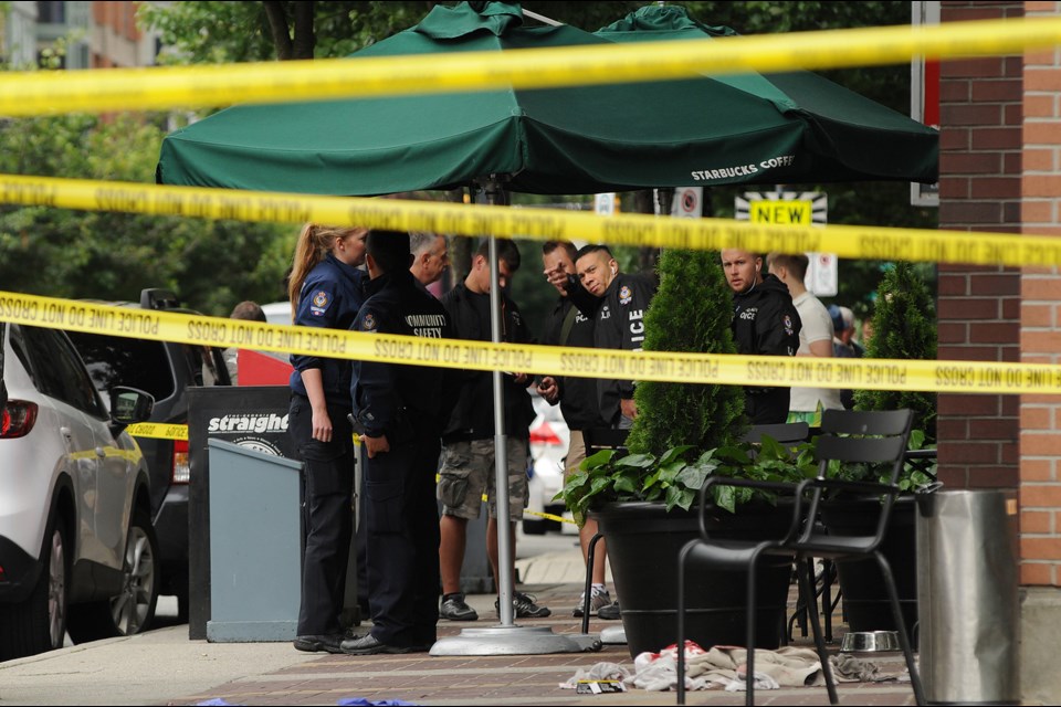 A man was seriously injured in a shooting at Davie Street and Marinaside Crescent outside of the Starbucks in Yaletown Tuesday morning. Photo: Dan Toulgoet