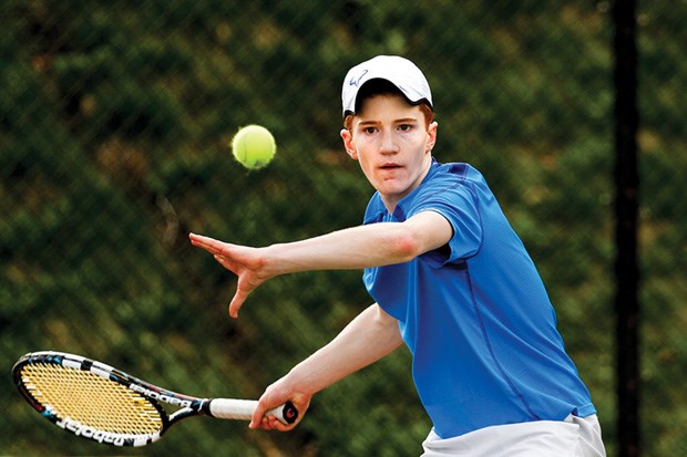 Isaac Davies loads up a forehand during a recent match. The Grade 9 ace helped Collingwood earn its seventh straight provincial AA title.