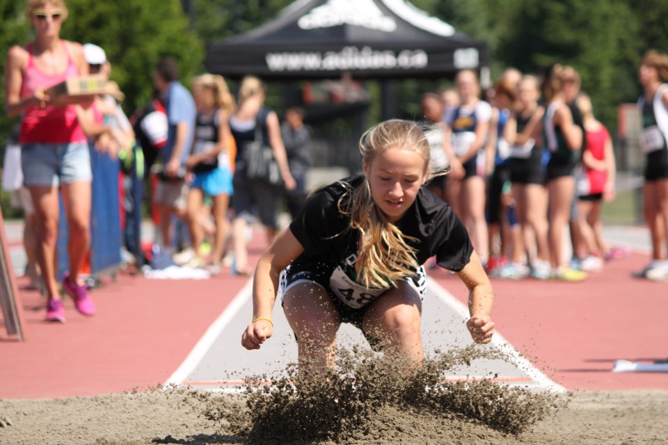 Emma Celle of the Royal City Track and Field Club lands her long jump at the Jesse Bent Memorial meet in Coquitlam.