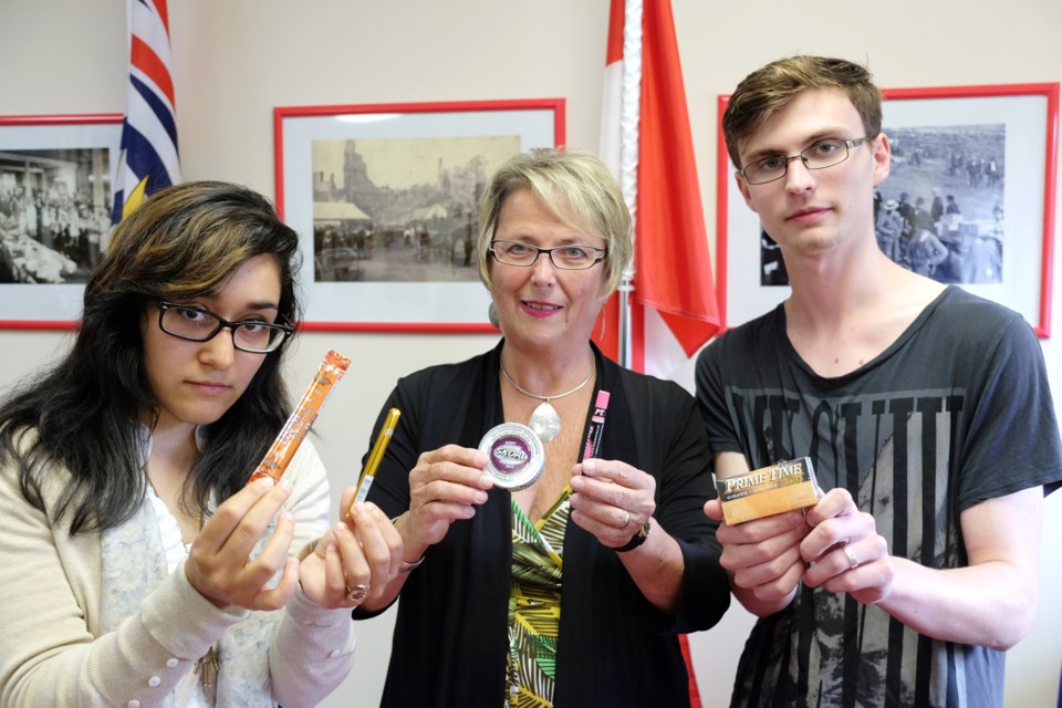 Dangerous? New Democrat health critic Judy Darcy, centre, along with NWSS grad Sabu Fatemi, left, and Douglas College student Brandon Eyre at a press conference held to call for a ban on flavoured tobacco products.