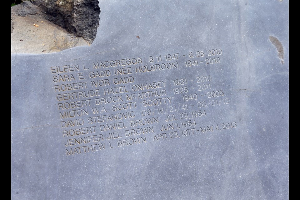 A common headstone marks the last resting place of those interred in the green burial plots at Royal Oak Burial Park.