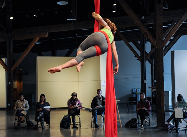 The Roundhouse community centre hosted aerial acrobats from Firebelly Performance Society to pose for artists while suspended in silk ribbons during this past Saturday’s Vancouver Draw Down festival. Photograph by: Rebecca Blissett