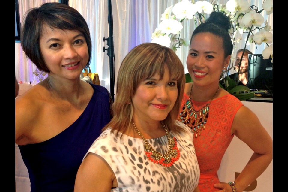 From left, clients Grace Cobankiat and Ivonne Penit joined marketing and sponsorship manager Christina Florencio for Dress for Success’s annual fundraiser Impact, held at the Lexus Dealership on Burrard.