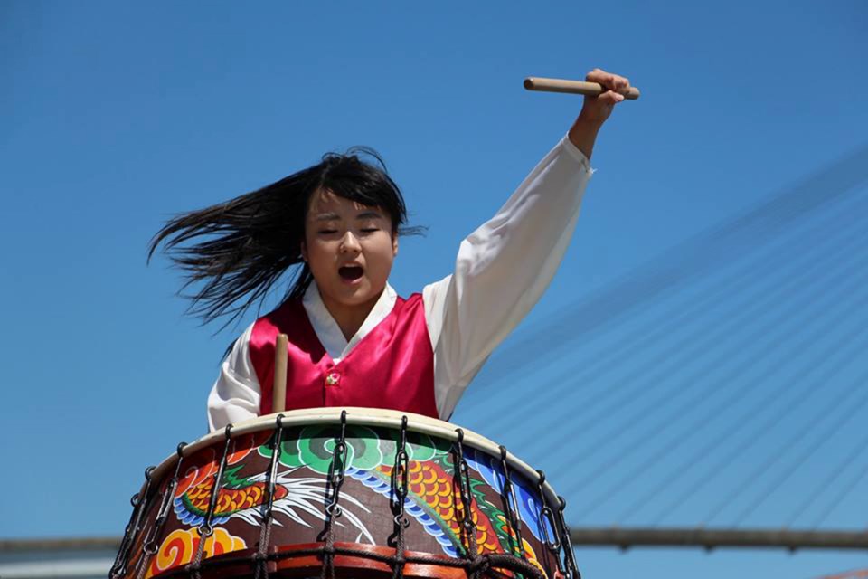 A performer from Cheondoong gets into the drumming spirit at the 1,000 Drummers of B.C. event June 21.