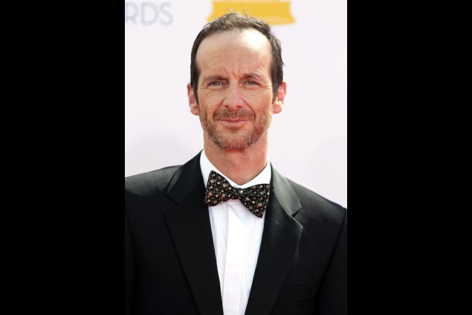 Denis O'Hare arrives at the 64th Primetime Emmy Awards at the Nokia Theatre on Sunday, Sept. 23, 2012, in Los Angeles. (Photo by Matt Sayles/Invision/AP)