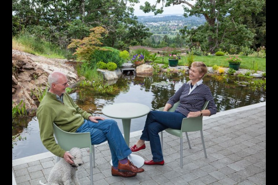 Owners Eric and Jorien, originally from the Netherlands, relax on their south-facing patio beside a deep pool which was designed and built by Chi Earth & Waterscape,