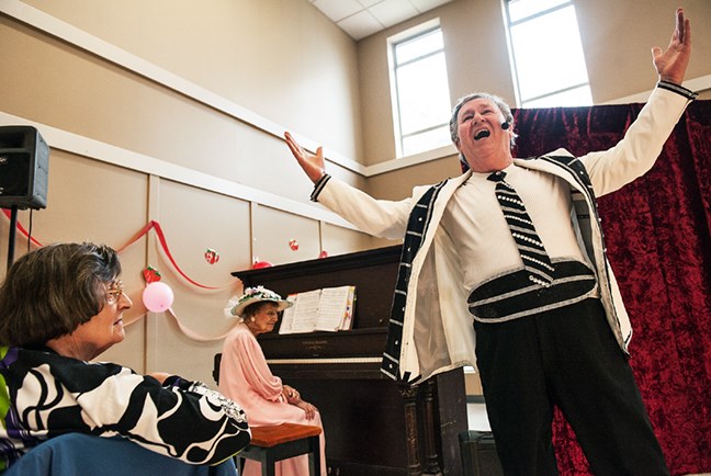 Dan Minor of The Vaudevillians performs a number at the South Granville Seniors Centre during its annual strawberry tea last Friday afternoon. Minor, along with Marilyn Remus, is also a choreographer with the vaudeville troupe. Photograph by: Rebecca Blissett