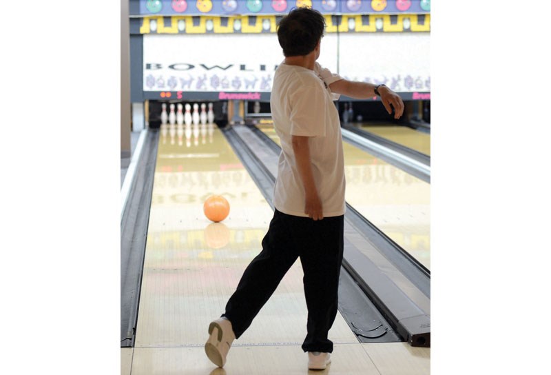 Linda Renner, a member of the Special Olympics 10-pin bowling team, releases a ball during practice at Strike Zone Friday afternoon.