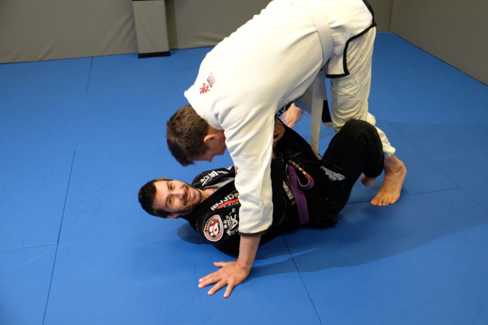 Scott Boudreau enjoys giving Burnaby NOW's Tom Berridge a workout in jiu jitsu