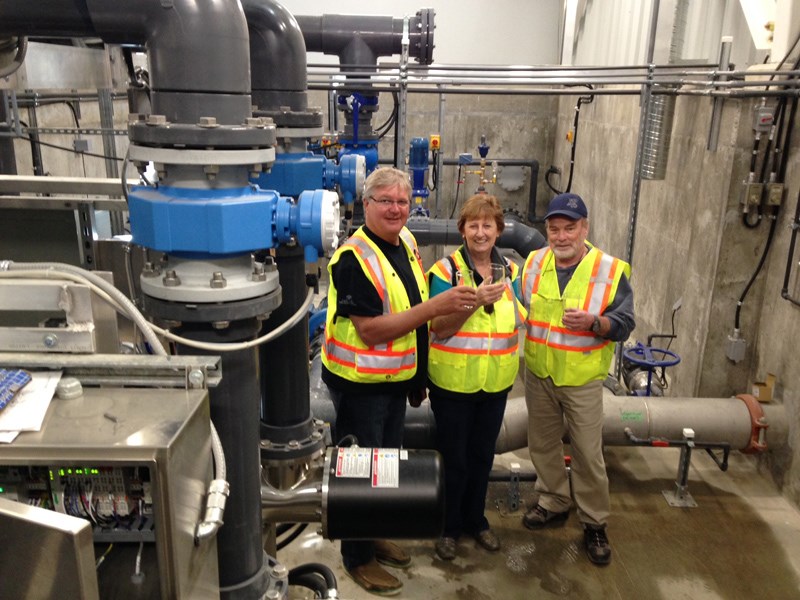 Members of the South Pender Harbour water advisory committee celebrate the June 27 start of operations at the $6.1-million water treatment plant. From left: Stu Dornbierer, Maureen Luck and Ted Taylor.