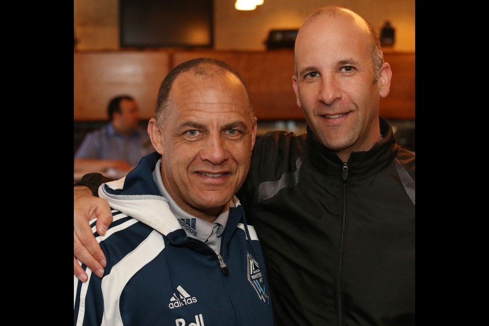 Carl Valentine, a former Vancouver Whitecaps legend, left, with Randy Wachtin.