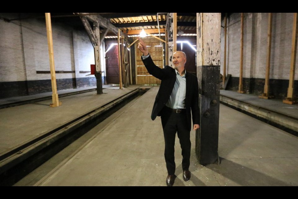 Architect Norm Hotson tours the Roundhouse, once part of a bustling railyard, in Vic West on Friday. Redevelopment plans for the national historic site, made up of a collection of buildings, include a marketplace featuring a boutique-style grocery store, restaurants and breweries as well as outdoor historical displays and an amphitheatre.