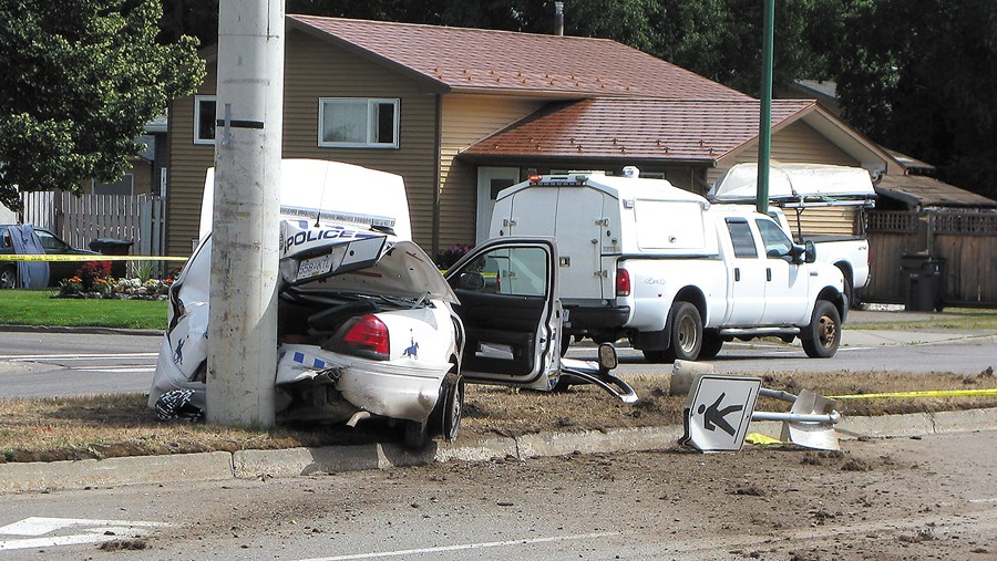 Cop car crash behind