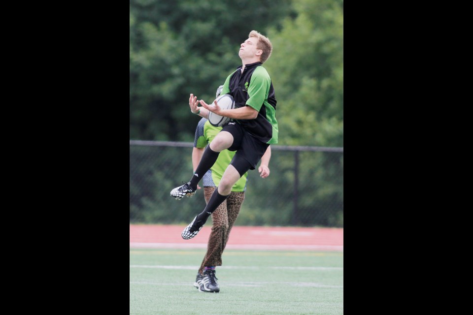07-19-2014
7s Rugby at the Highland Games on SFU Turf Field Dragons in funny costumes and green jerseys VS the Young Bucks
photo Lisa King