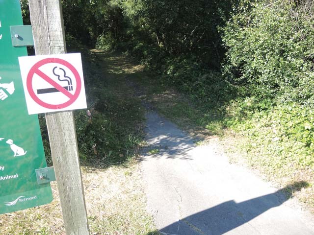 A non-smoking sign at an entrance to the Shell Road Trail defines the fire risk during the hot summer months.