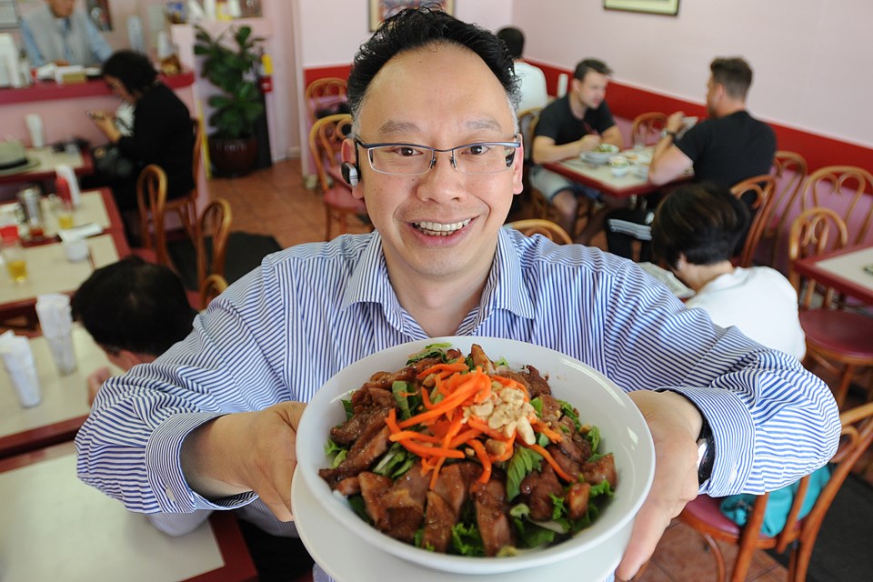 Do Minh Trinh’s parents started Au Petit Café. One of his favourites is the barbecue lemongrass chicken on rice noodles with veggies and fish sauce. Photo Dan Toulgoet