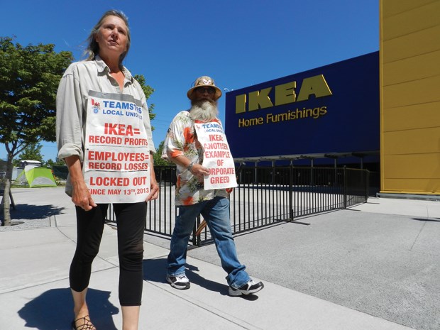 Ikea workers walk the picket line Monday outside the Richmond store